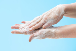 Hands lathered with soap, showing the importance of hand hygiene to prevent infectious diseases.