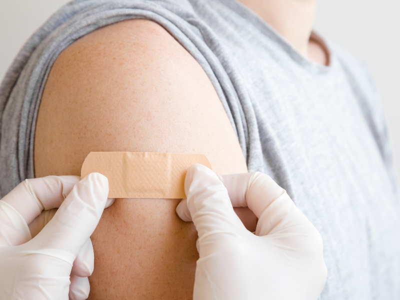 A doctor administering a rabies vaccine to a patient after an animal bite