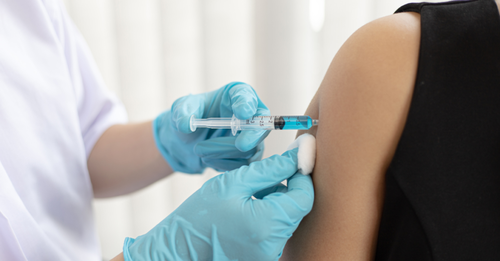 Healthcare worker giving a Hepatitis B vaccine to a patient