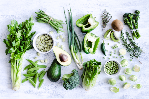 A variety of nutrient-rich green vegetables and fruits supporting mental health