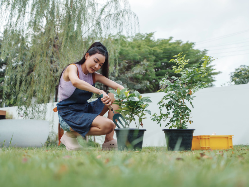 Woman gardening as a natural stress-relief activity to reduce cortisol and support hormonal balance.