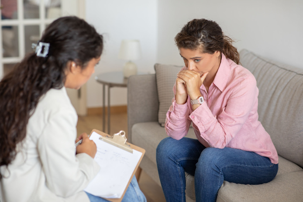 A woman receiving therapeutic support during a counseling session