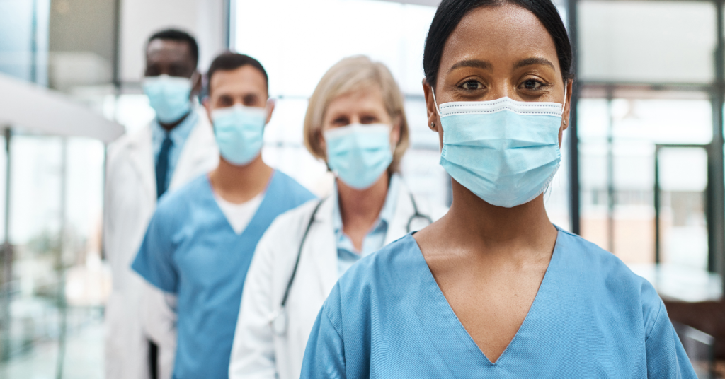 Healthcare workers wearing masks in a hospital, representing preparedness during respiratory illness outbreaks.