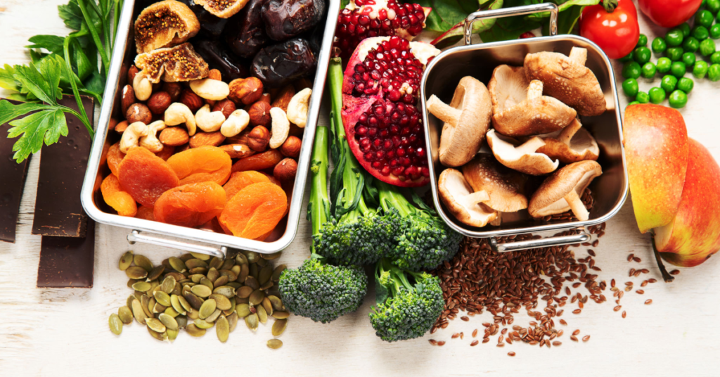 Dried fruits, nuts, broccoli, and seeds arranged on a table, showcasing nutrient-dense options for overall health.